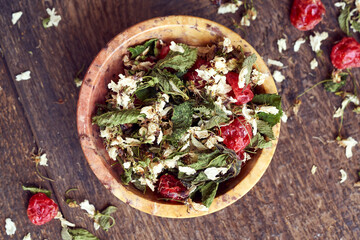 Tea mix made from cherry blossoms and young leaves and dried cherry fruit, top view