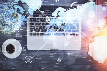 Social network hologram drawings over computer on the desktop background. Top view. Double exposure.