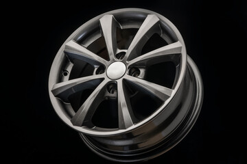 the new alloy wheel is grey on a black background. auto parts and tuning, side view