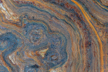 grunge background: curly rust on an old metal surface, toning