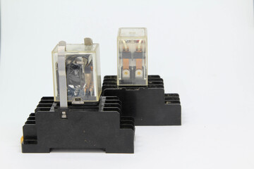 The electrical auxiliary relay in transparent plastic cases on white background.