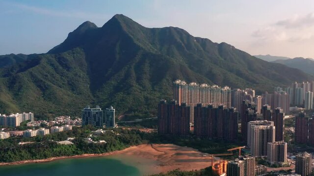 Aerial view of mountain with a sunny day of Hong Kong China in Ma On Shan and Wu Kai Sha Beach Starfish Bay. Parallax drone shot.