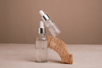 Eco Mineral oil in Amber glass bottles with pipette. Transparent hyaluronic serum gel and skin care concept. Top horizontal view copyspace of dropper glass.