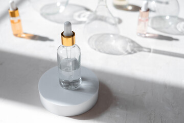 Eco Mineral oil in glass bottles with pipette dropper. Transparent hyaluronic serum gel and skin care concept. Top horizontal view.