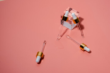 Dropper glass bottles with pipette. Transparent hyaluronic natural beauty product and eco serum skin care concept. Top horizontal view copyspace