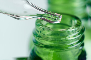 Dropper glass bottles with pipette. Transparent hyaluronic natural beauty product and eco serum skin care concept. Top horizontal view copyspace