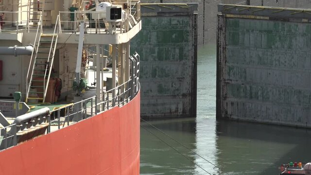 A cargo ship passes through the gates of the Panama Canal.