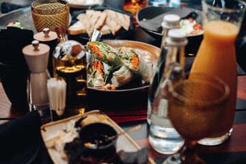 Veggie rolls in plate on served table.