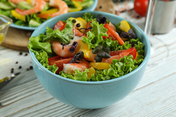 Concept of tasty eating with shrimp salad, close up