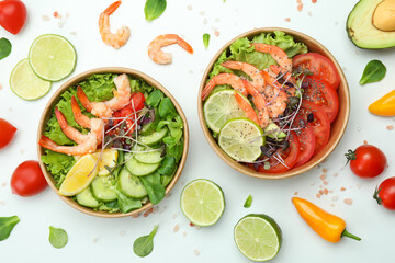 Concept of tasty eating with shrimp salads on white background