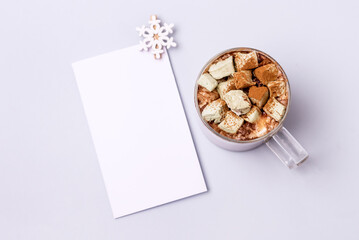 Cup Of Hot Chocolate with Homemade Marshmallows on a Light Blue background White Blanck Holiday Morning Breakfast Concept Horizontal