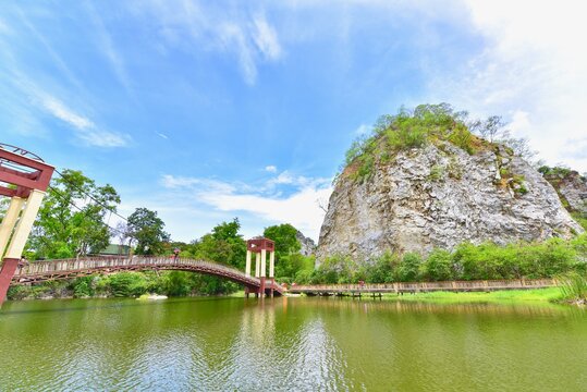 View of Suspension Bridge and Limestone Hills at Khao Ngu Stone Park in Ratchaburi Province