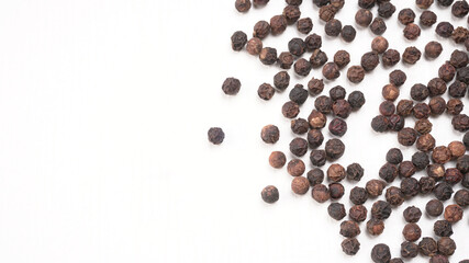 Group of Organic Black pepper isolated on white background. Selective focus and Top view (Flat Lay)