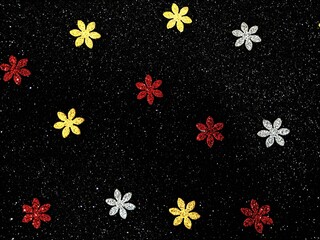 seamless black background with red , yellow nd white glittery small flowers