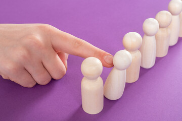 Personnel management in business. Concept of personnel management in company. Manager deals with human resource management. Selection of human resources for company. Man hand moves white figures.
