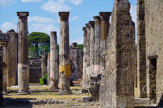 Famous landmark of ancient and historic city temple ruins with columns and walls on archeologic site museum Pompeji Pompeii excavation site in Italy near Naples and Vesuv Volcano