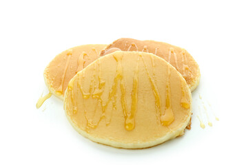 Tasty pancakes with honey isolated on white background