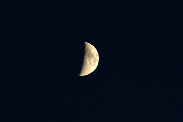 A crescent moon in the evening sky in the northern hemisphere.