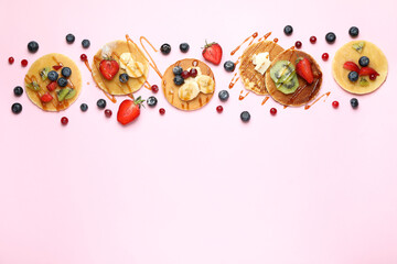 Concept of delicious dessert with pancakes on pink background