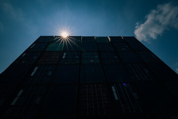 Fototapeta premium container with sun flair blue sky background