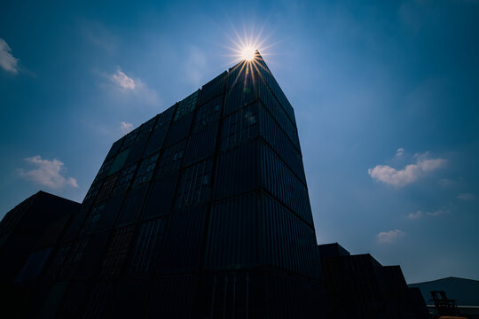 Container With Sun Flair Blue Sky Background