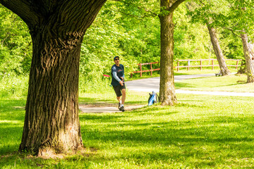 Disc golf is a flying disc sport in which players throw a disc at a target; it is played using...