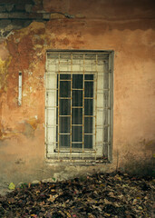 Fototapeta na wymiar Abandoned. A window in an old ruined stone house.
