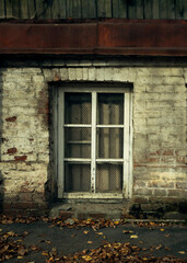Abandoned. Barred window in an old brick building.