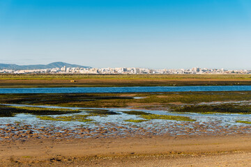 City of Faro seen from Faro Beach Peninsula with wetlands of Ria Formosa in the foreground, Algarve, Portugal