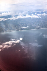 above the clouds over the coast of Bali