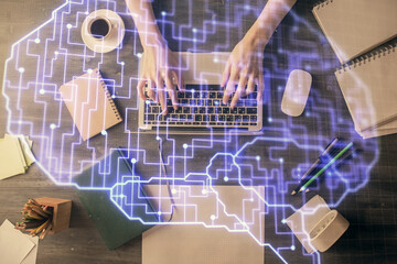 Double exposure of woman working on computer andhuman brain hologram drawing. Top View. Ai concept.