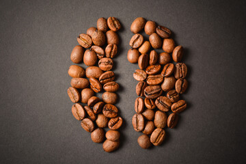 Top view of Coffee bean shape isolated on dark background. Coffee seed silhouette of roasted high quality coffee beans. Aroma drink
