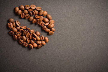 Horizontal background image of Coffee bean shape isolated on dark background. Coffee seed silhouette of roasted high quality coffee beans. Aroma drink
