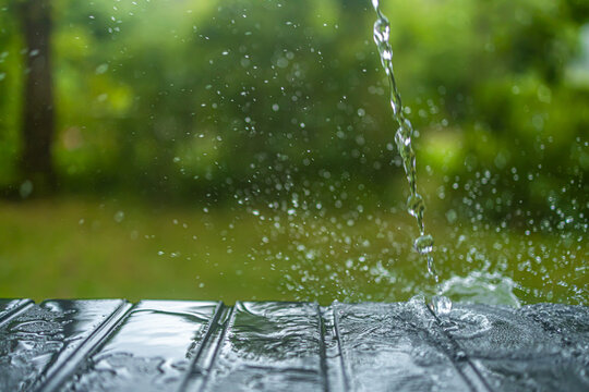 Water Slash And Drops Of Water At A Bench