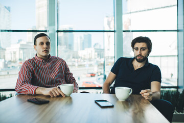 Multiracial colleagues sitting in modern office