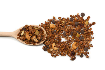 Chocolate granola cereal with nuts in a wooden spoon.