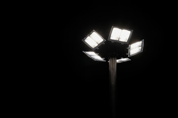Silhouette lighting pole, street light or lamppost illuminating by solar cell panel at night sky...