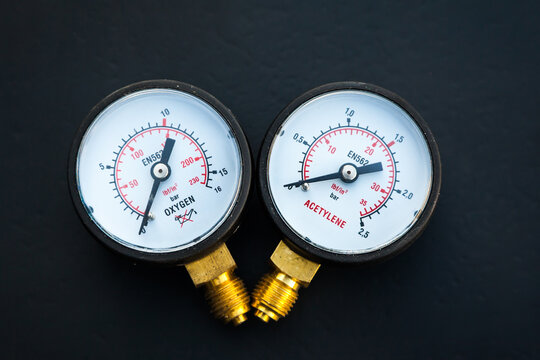 Two new manometers for acetylene and oxygen on a black background.
