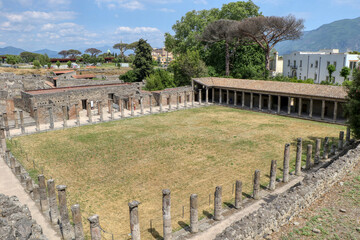Fototapeta na wymiar Archaeological Park of Pompeii. Quadriporticus of the theaters or gladiator barracks. Campania, Italy