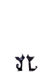 Origami cats over white background