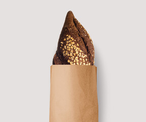 Fresh bread baked with seeds in a kraft paper bag, natural, white or black! - 437952775