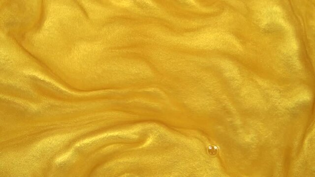 golden water on black background