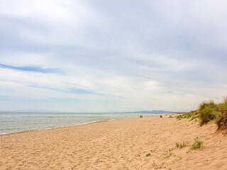 An empty sandy beach awaiting tourists during the non-tourist season.