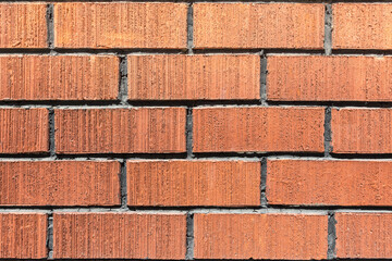 Obraz premium The texture of a stone wall made of red clay bricks. As a natural abstract background.