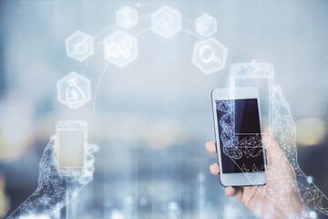 Double exposure of tech icon hologram and woman holding and using a mobile device. Technology concept.