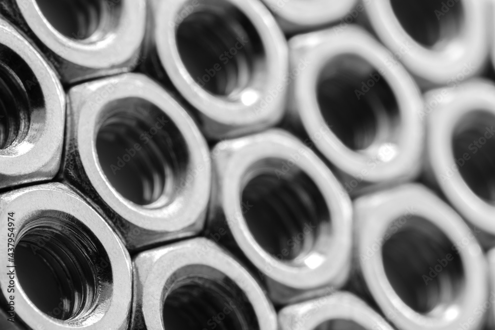 Aufkleber Metal nuts in a row background. Chromed screw nuts. Steel nuts pattern. Tools for work.