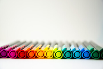 Colourful pencils in a row