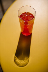 lemonade with ice on yellow table on summer terrace. refreshment summer cold drink