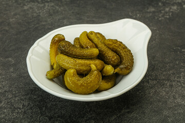 Pickled gherkin in the bowl