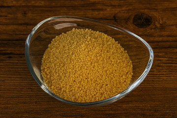 Raw cous cous heap in the bowl